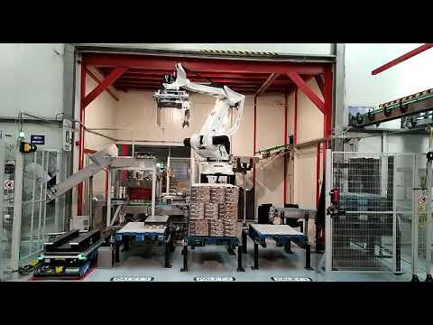 AGV + COMAU Palletizer and orbital stretch wrapper plant