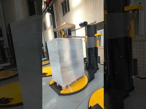 Pallet wrapping machine with top press