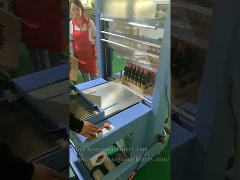 Automatic heat shrink packaging machine for bottles