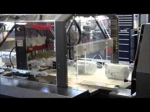 Automated shrink wrap machine and oil filter shrink wrapping