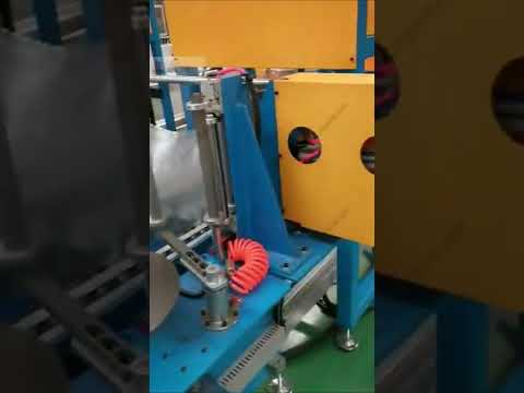 Automatic cable coil strapping machine with two heads