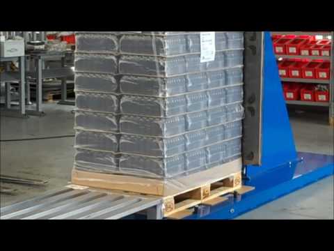 Stationary Pallet Changer - Transferring medicine glass bottles