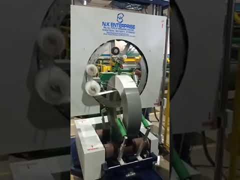 Vertical coil wrapping machine