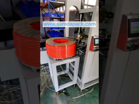 Automatic strapping machine for tube coil strapping