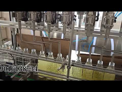 AUTOMATIC OIL FILLING CAPPING LABELING MACHINES