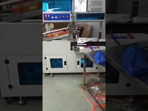 Automatic bottle shrink wrapping packing machine