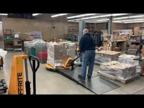 Using a pallet jack to unload a pallet wrapper