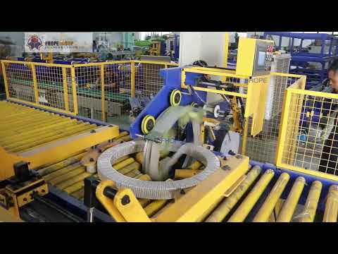 horizontal coil packing machine with holding arm