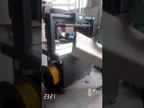 Box cardboard top pressing strapping sealing packaging machine