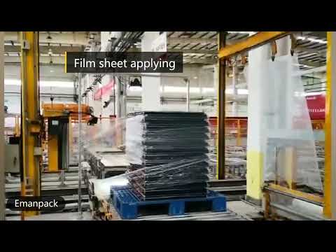 Rotary arm pallet stretch wrapping machine with top film sheet dispenser