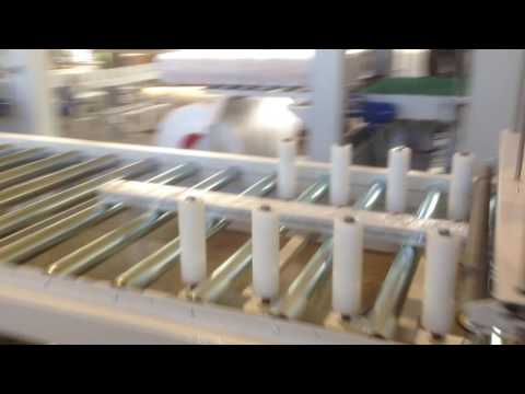 Horizontal stretch wrapping machine AT 1200 A 250 with motorized roller conveyors