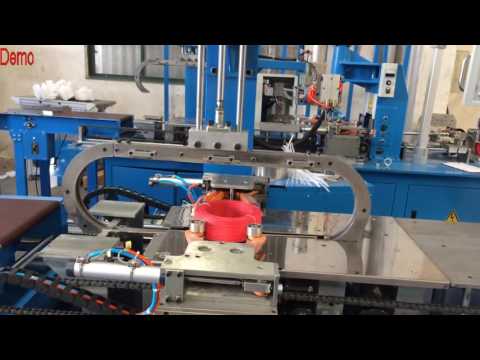 Automatic cable strapping machine and cable coiler