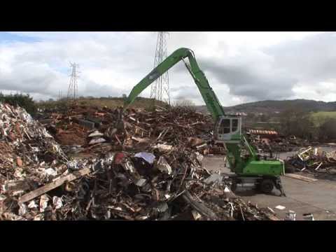 SENNEBOGEN - Scrap Handling: 830 Mobile Material Handler loading scrap into shredder at SIMS, UK