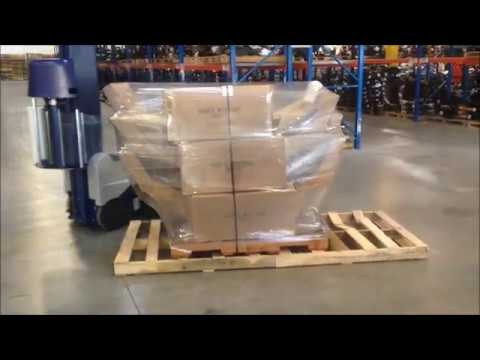 Robot S6 portable semi-automatic stretch wrapper wrapping automotive parts - Robopac USA