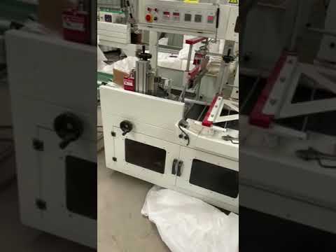 Automatic long tube shrink wrapping machine