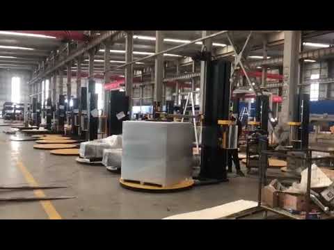 pallet wrapping machine with top press and ramp