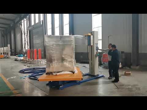 Pallet wrapping machine with slewing ring