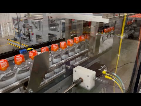 Wrapping Multipacks of Supplement Bottles with Orbital Motion Vertical Shrink Wrapper