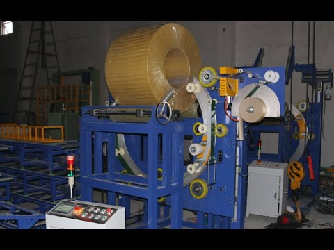 Operation of coil wrapping machine with two layer wrapping