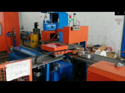 Automatic steel wire coiling and strapping machine