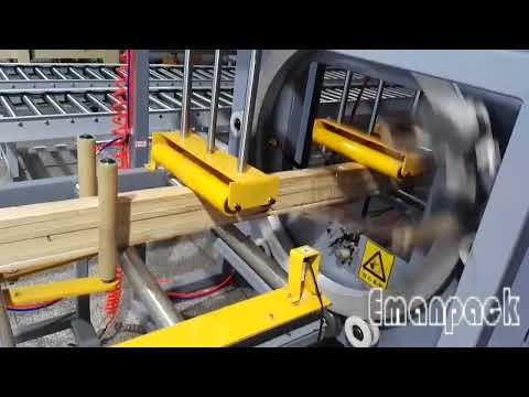 Orbital wrapper machine using stretch film to wrap bundles of wood material