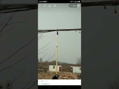 Power workers are strapping cables at high altitude