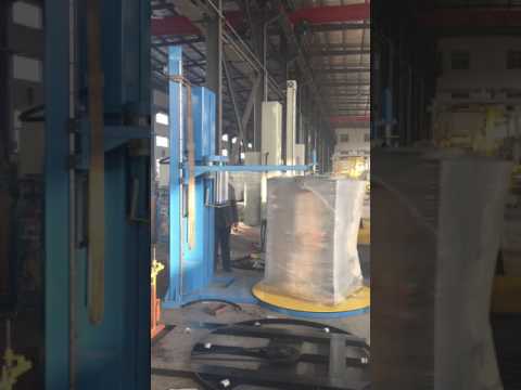 Top sheet pallet stretch wrapping machine