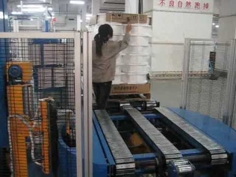 Automatic pallet packing line and strapping machine for fabric