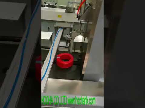 Automatic wire and cable coiling and heat shrink wrapping machine