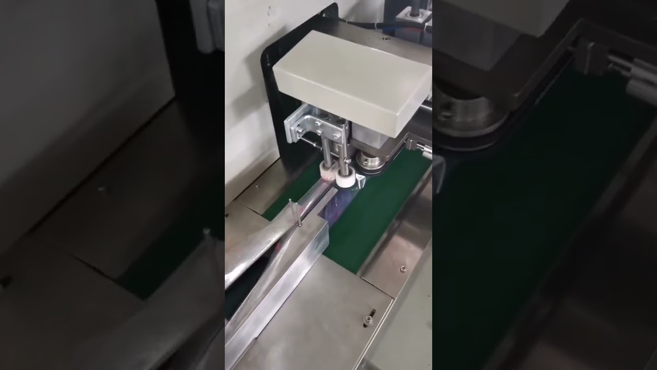 Horizontal flow wrapping machine for coil roll packaging. - Wrapping ...